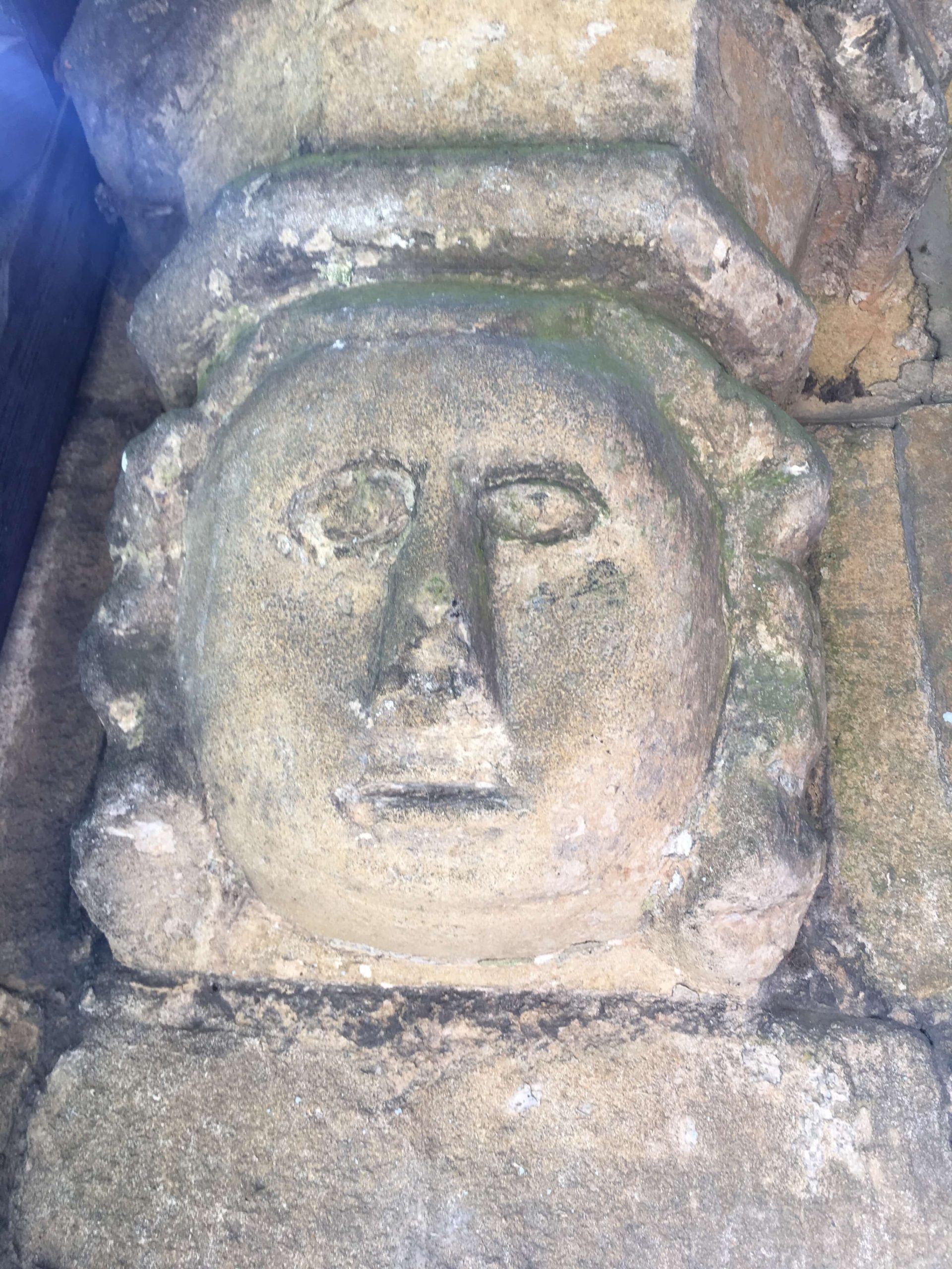 Image of a face carved in stone Church Langton Church