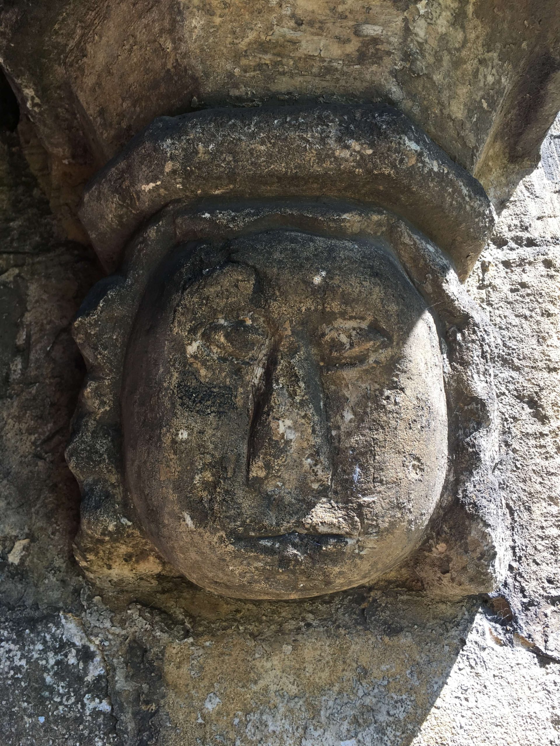 Image of a face carved in stone Church Langton Church