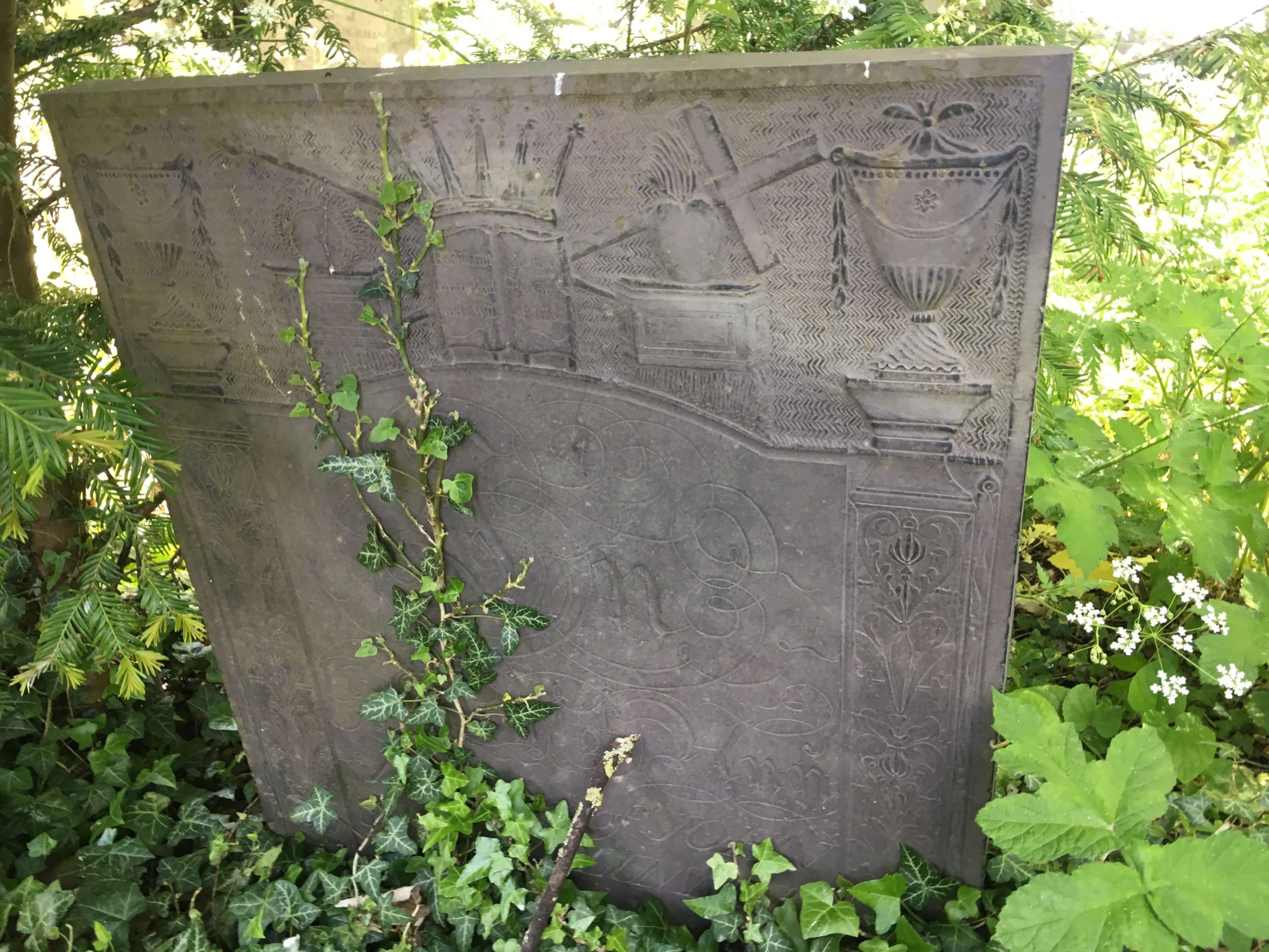 Swithland slate headstone with crown, anchor and urns. Church Langton