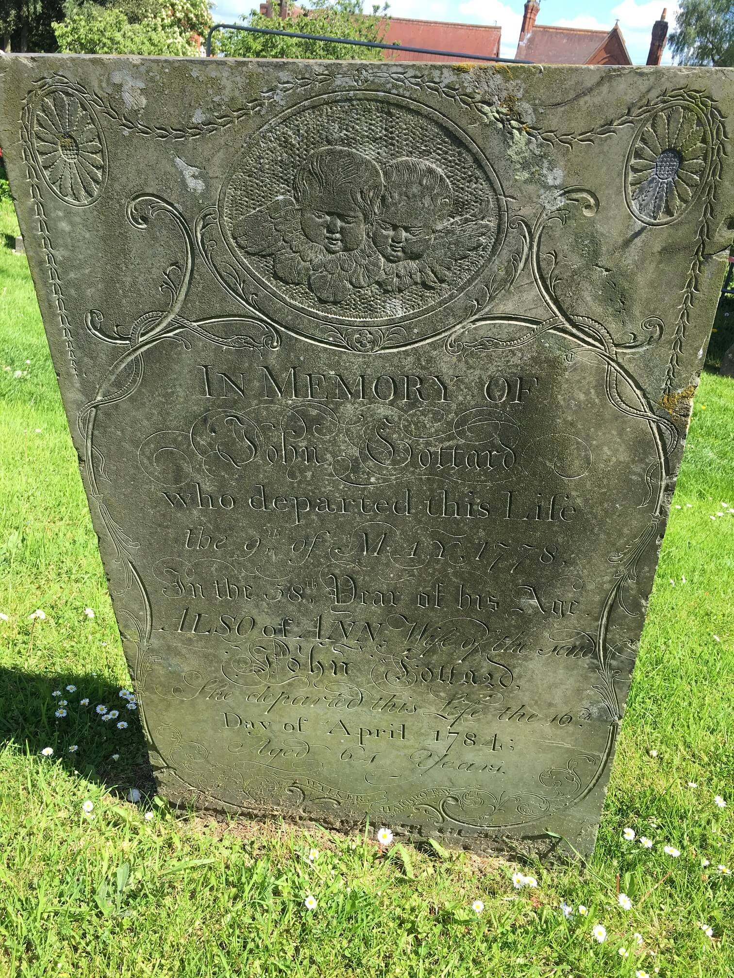 Swithland slate headstone with cherubs. Church Langton