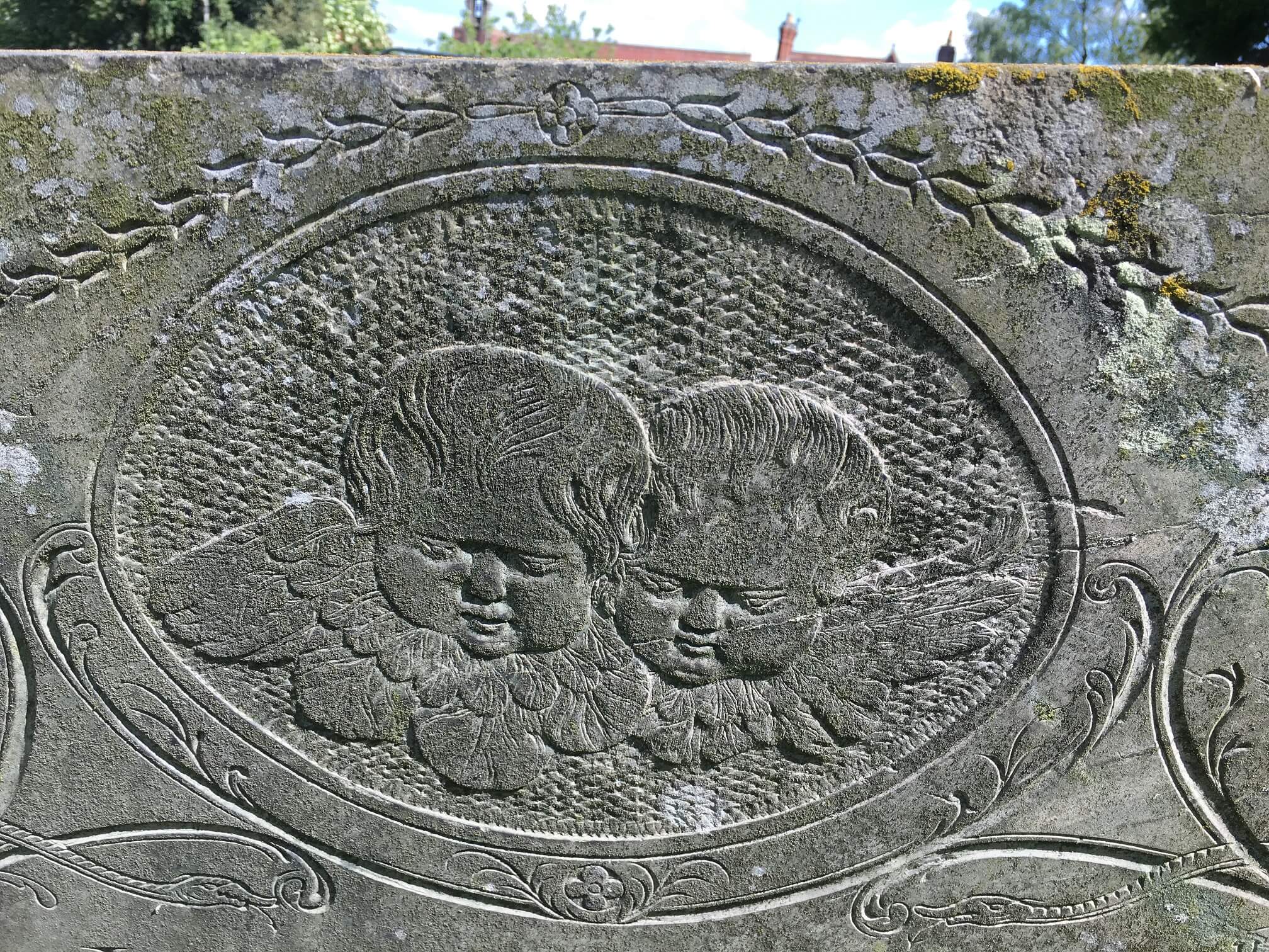 Close up of cherubs on swithland slate headstone. Church Langton
