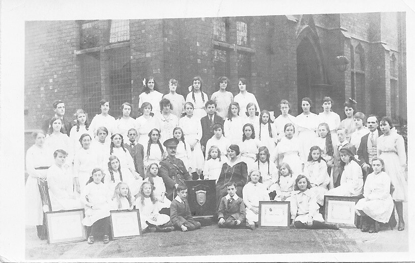 Black and white photo of a group outside of a church, Bolton
